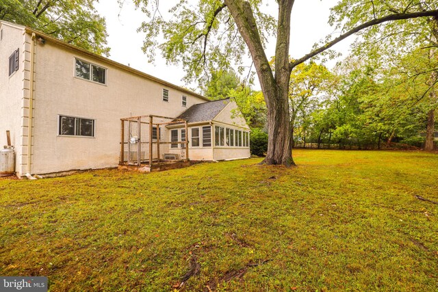 view of yard with a sunroom