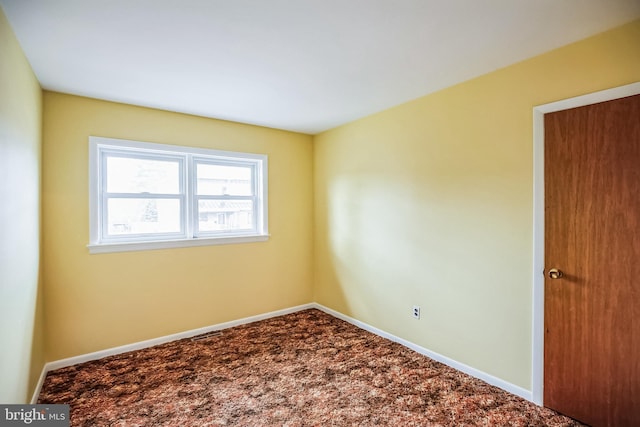 empty room featuring carpet floors