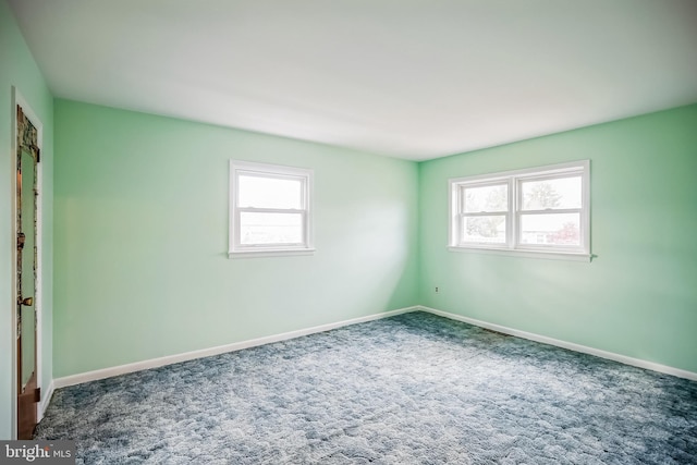 empty room with carpet flooring