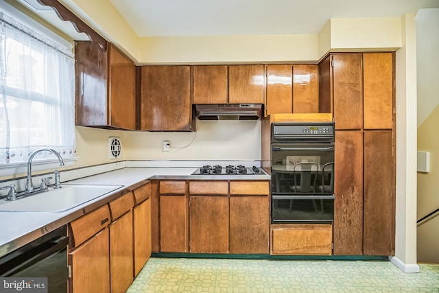 kitchen with sink and black appliances