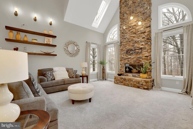 living room with carpet, plenty of natural light, and high vaulted ceiling