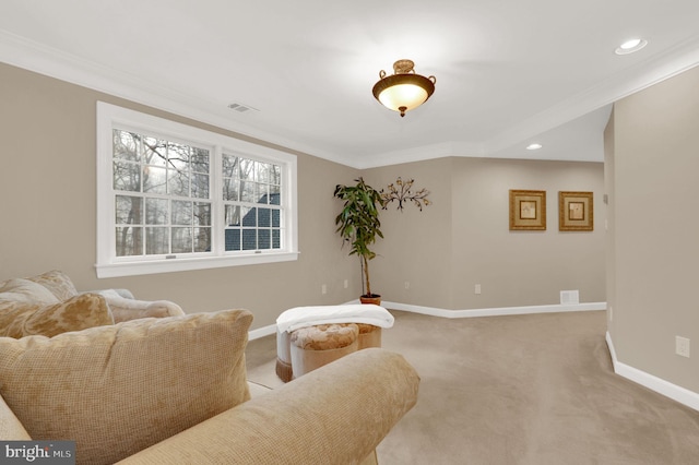 living area with light colored carpet and crown molding