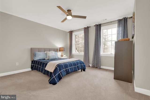 bedroom featuring ceiling fan and light carpet