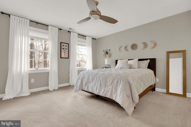 carpeted bedroom featuring ceiling fan