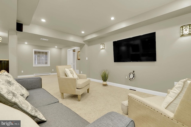 carpeted home theater room featuring baseboard heating