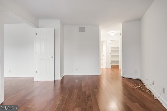 unfurnished room featuring dark hardwood / wood-style floors