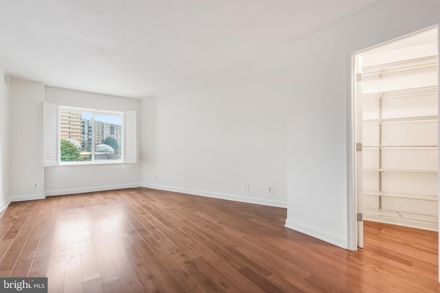 unfurnished room featuring wood-type flooring