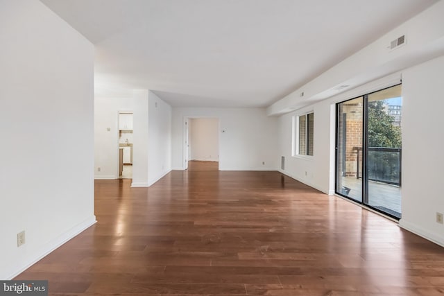 empty room featuring dark wood-type flooring