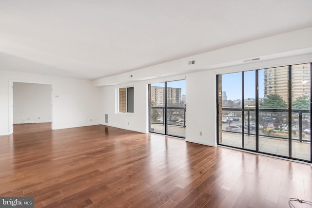 empty room featuring wood-type flooring