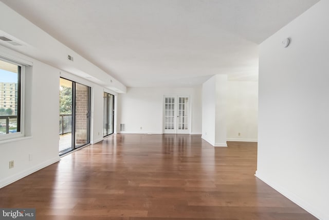 unfurnished room featuring dark hardwood / wood-style floors