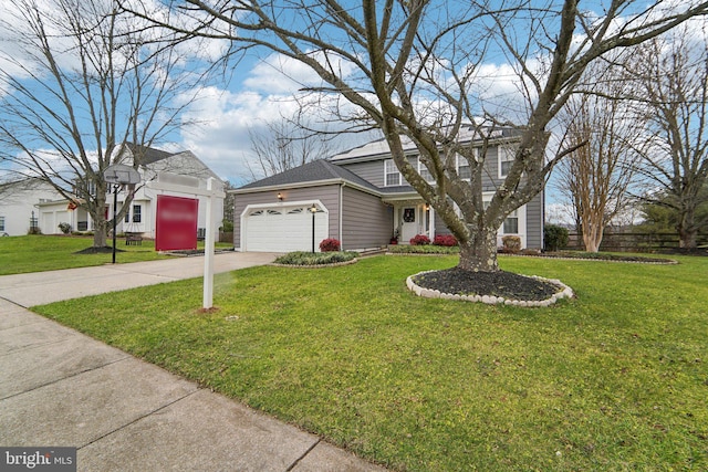 view of front of property with a front yard and a garage