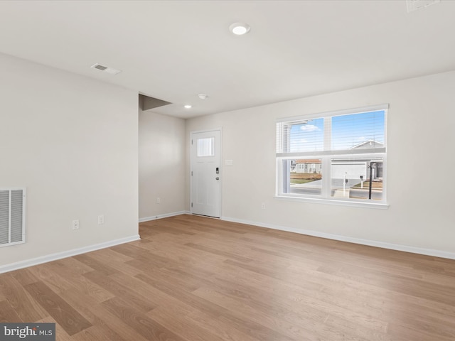 unfurnished living room with light wood-type flooring