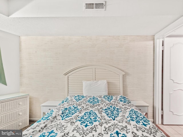 bedroom featuring light tile patterned floors