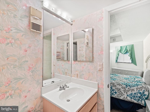 bathroom with vanity and a textured ceiling