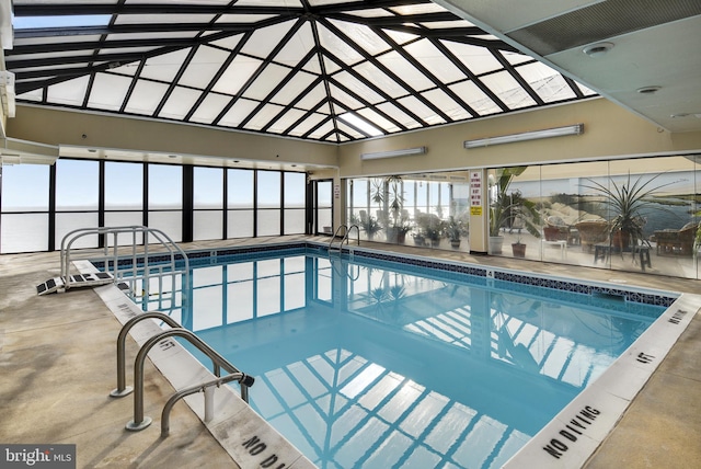 view of swimming pool with a water view