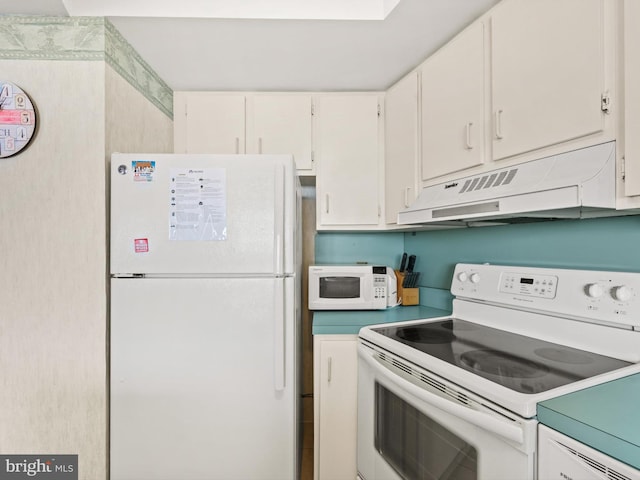 kitchen featuring white cabinets, white appliances, and extractor fan