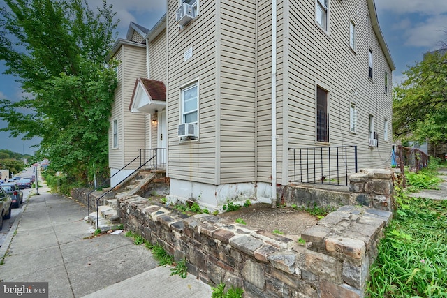 view of property exterior with cooling unit