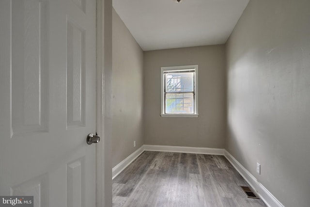 spare room featuring light wood-type flooring