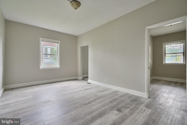 spare room featuring light hardwood / wood-style flooring