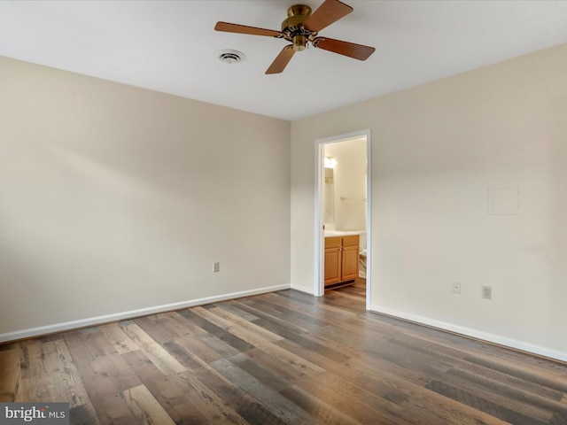 unfurnished room featuring ceiling fan and dark hardwood / wood-style flooring