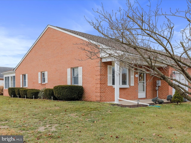 view of property exterior featuring a lawn