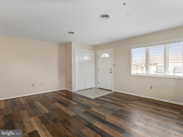 entrance foyer featuring dark hardwood / wood-style floors