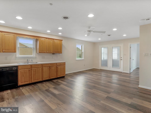 kitchen featuring dishwasher, dark hardwood / wood-style flooring, ceiling fan, and sink