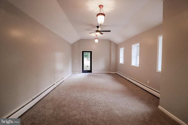 unfurnished room with carpet flooring, ceiling fan, vaulted ceiling, and a baseboard heating unit