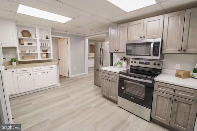 6381 Glatfelters Station Rd, Seven Valleys, PA 17360 - kitchen with appliances with stainless steel finishes, a drop ceiling, open shelves, and light countertops