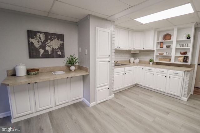 6381 Glatfelters Station Rd, Seven Valleys, PA 17360 - kitchen featuring a drop ceiling, white cabinetry, open shelves, light wood-type flooring, and light countertops