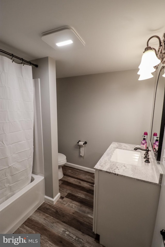 full bathroom with toilet, vanity, shower / bath combo, and hardwood / wood-style flooring