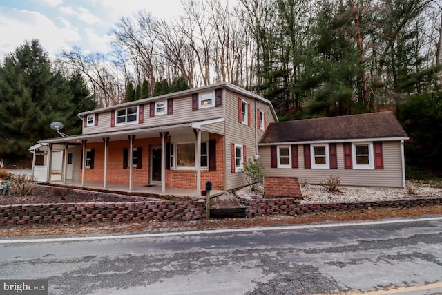 6381 Glatfelters Station Rd, Seven Valleys, PA 17360 - view of front of property featuring covered porch and brick siding