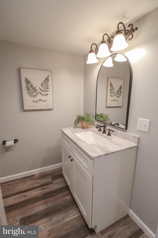 6381 Glatfelters Station Rd, Seven Valleys, PA 17360 - bathroom with vanity, wood finished floors, and baseboards