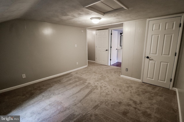 unfurnished bedroom with carpet flooring and a textured ceiling