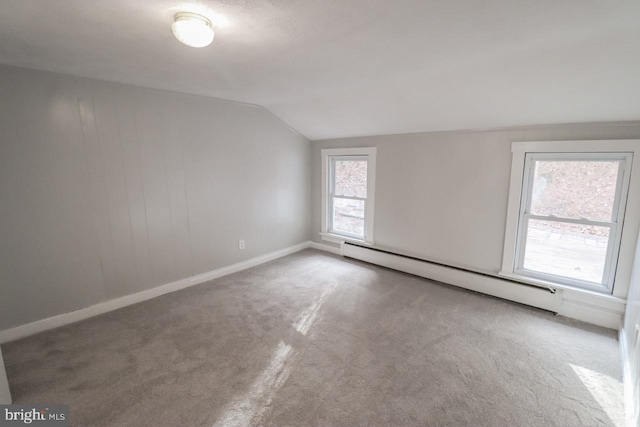 6381 Glatfelters Station Rd, Seven Valleys, PA 17360 - carpeted spare room featuring a baseboard heating unit, vaulted ceiling, and baseboards