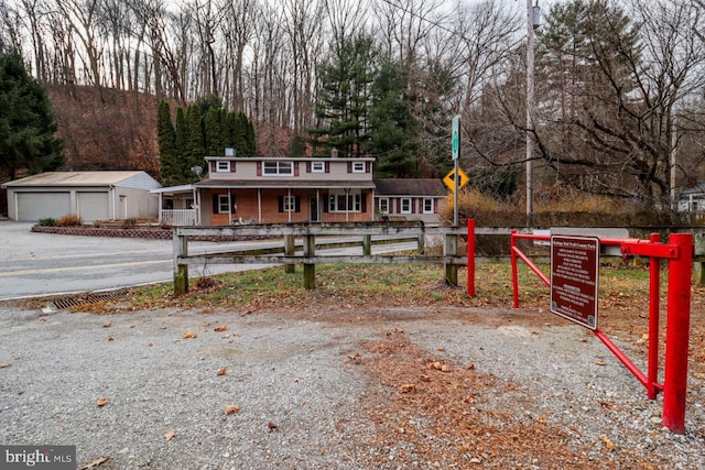 6381 Glatfelters Station Rd, Seven Valleys, PA 17360 - view of front facade featuring a garage, covered porch, and an outdoor structure