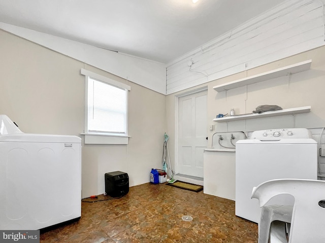 laundry room featuring washing machine and clothes dryer