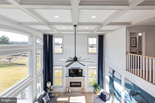 living room with hardwood / wood-style flooring, a healthy amount of sunlight, and coffered ceiling