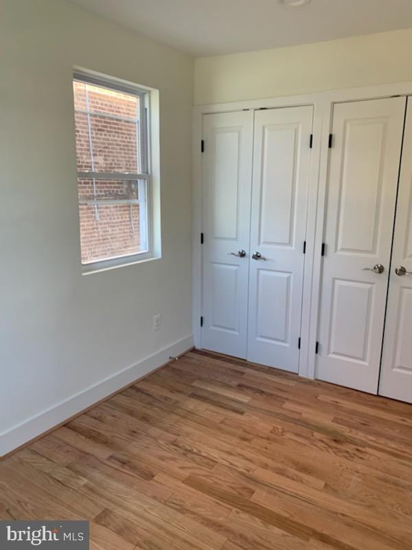 unfurnished bedroom featuring light hardwood / wood-style flooring