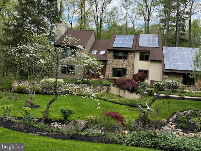 view of home's community featuring a yard