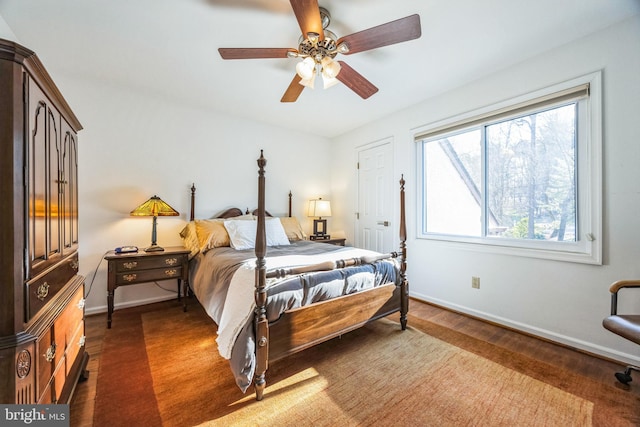 bedroom featuring ceiling fan and dark hardwood / wood-style flooring