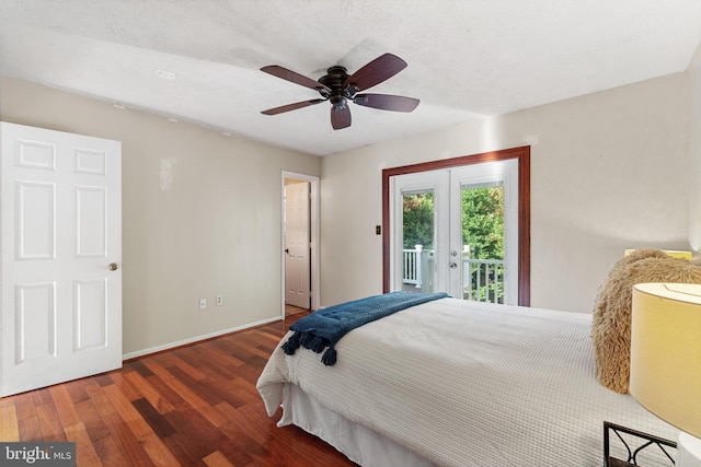 bedroom featuring access to exterior, ceiling fan, dark hardwood / wood-style flooring, and a textured ceiling