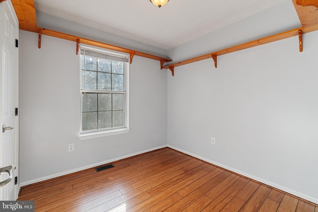 empty room featuring wood-type flooring