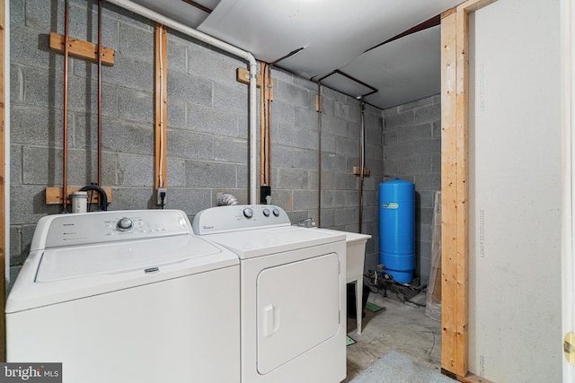 washroom with washing machine and clothes dryer