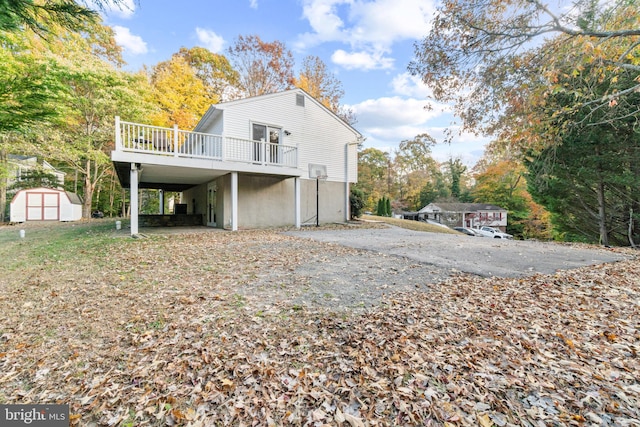 back of house featuring a wooden deck