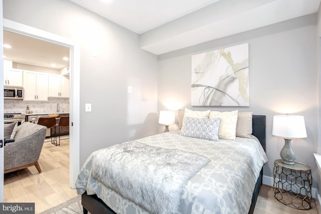 bedroom featuring light hardwood / wood-style floors