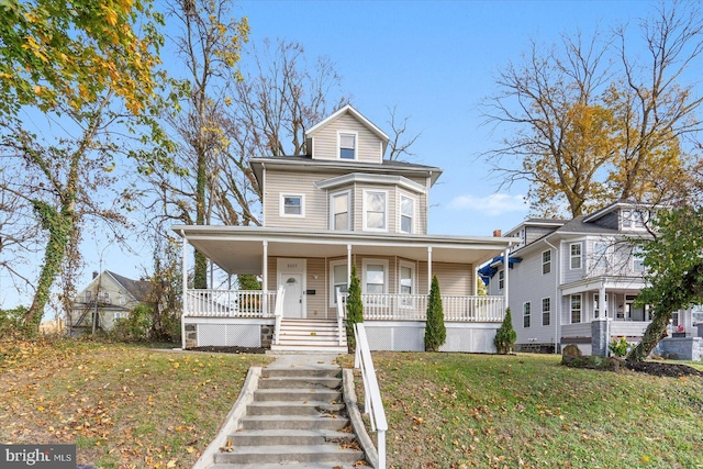 view of front of house featuring a front lawn and a porch