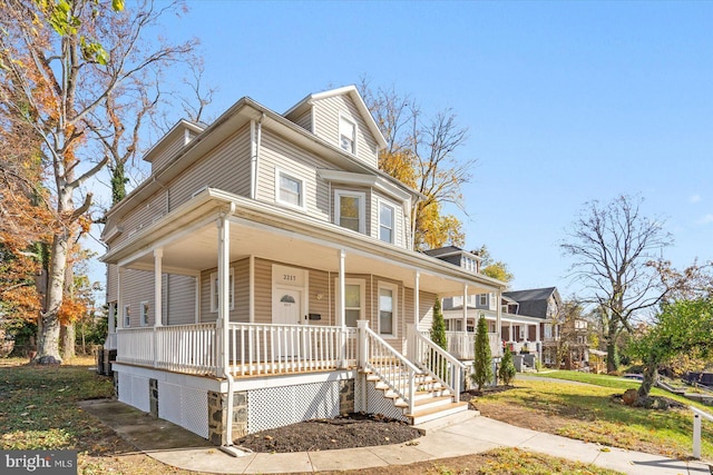 view of front of home with a front lawn and a porch