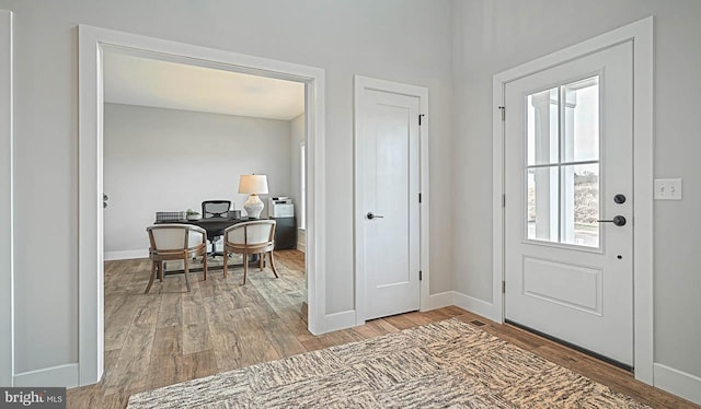 entryway with wood-type flooring