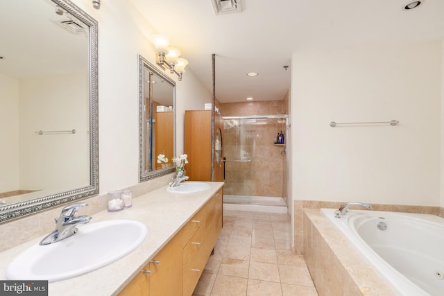 bathroom with tile patterned floors, separate shower and tub, and vanity